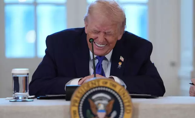President Donald Trump smiles during a meeting with oil executives in the East Room of the White House, Friday, Jan. 9, 2026, in Washington. (AP Photo/Evan Vucci)