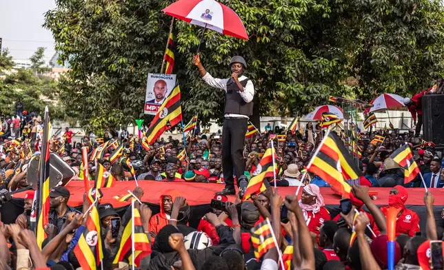 Uganda opposition presidential candidate Robert Kyagulanyi Ssentamu, known as Bobi Wine, addresses supporters during his final campaign rally at Aga Khan Grounds, in Kampala, Uganda, Monday, Jan. 12, 2026. (AP Photo/Samson Otieno)
