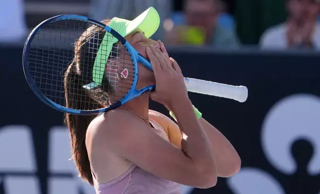 Zeynep Sonmez of Turkey reacts after defeating Ekaterina Alexandrova of Russia in their first round match at the Australian Open tennis championship in Melbourne, Australia, Sunday, Jan. 18, 2026. (AP Photo/Asanka Brendon Ratnayake)