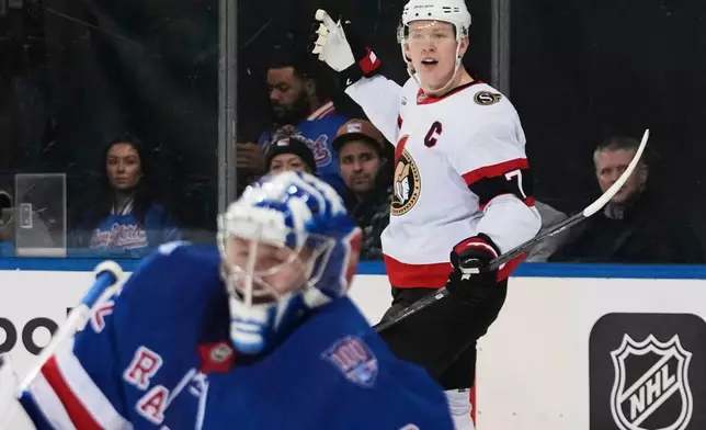 Ottawa Senators' Brady Tkachuk (7) celebrates after scoring a goal as New York Rangers goaltender Jonathan Quick (32) looks away during the first period of an NHL hockey game Wednesday, Jan. 14, 2026, in New York. (AP Photo/Frank Franklin II)