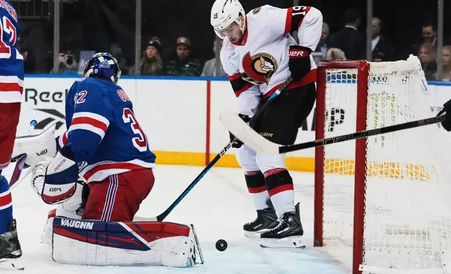 Ottawa Senators' Drake Batherson (19) scores a goal as New York Rangers goaltender Jonathan Quick (32) reacts during the first period of an NHL hockey game Wednesday, Jan. 14, 2026, in New York. (AP Photo/Frank Franklin II)