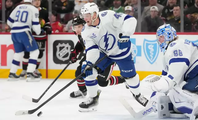 Tampa Bay Lightning defenseman Darren Raddysh (43) handles the puck during the second period of an NHL hockey game against the Chicago Blackhawks, Friday, Jan. 23, 2026, in Chicago. (AP Photo/Erin Hooley)