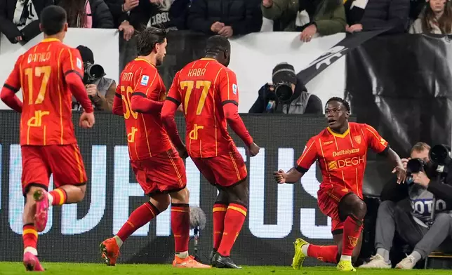 Lecce's Lameck Banda, right, celebrates scoring with teammates during the Serie A soccer match between Juventus and Lecce in Turin, Italy, Saturday Jan. 3, 2026. (Fabio Ferrari/LaPresse via AP)