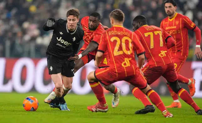 Juventus' Kenan Yildiz, left, and Lecce's Kialonda Gaspar in action during the Serie A soccer match between Juventus and Lecce in Turin, Italy, Saturday Jan. 3, 2026. (Fabio Ferrari/LaPresse via AP)