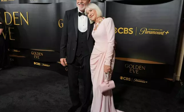 Taylor Hackford, left, and Helen Mirren arrive at the Golden Globes Golden Eve on Tuesday, Jan. 6, 2026, at The Beverly Hilton Hotel, in Beverly Hills, Calif. (Photo by Jordan Strauss/Invision/AP)