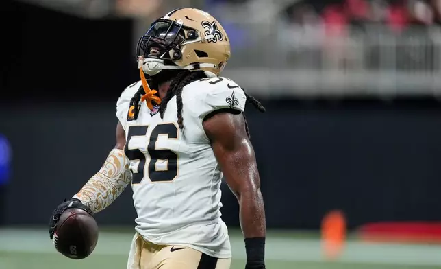 New Orleans Saints linebacker Demario Davis (56) celebrates in the first half of an NFL football game against the Atlanta Falcons, Sunday, Jan. 4, 2026, in Atlanta. (AP Photo/Brynn Anderson)