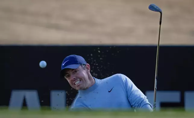 Rory McIlroy of Northern Ireland hits a shot from a bunker on the 15th hole during first round of the Dubai Desert Classic in United Arab Emirates, Thursday, Jan. 22, 2026. (AP Photo/Altaf Qadri)