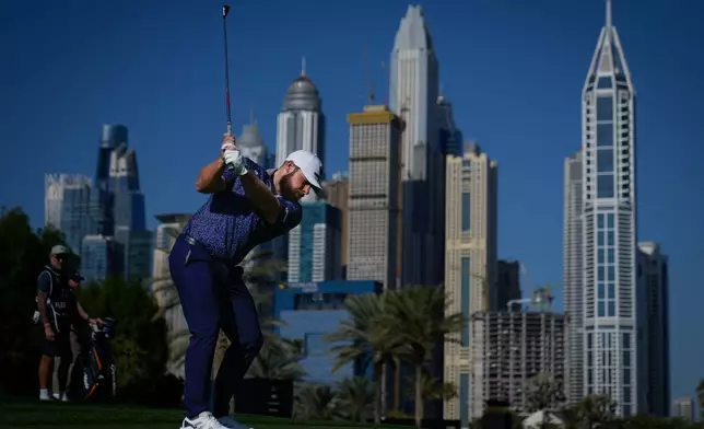 Tyrrell Hatton of England plays his second shot on the 16th hole during first round of the Dubai Desert Classic in United Arab Emirates, Thursday, Jan. 22, 2026. (AP Photo/Altaf Qadri)