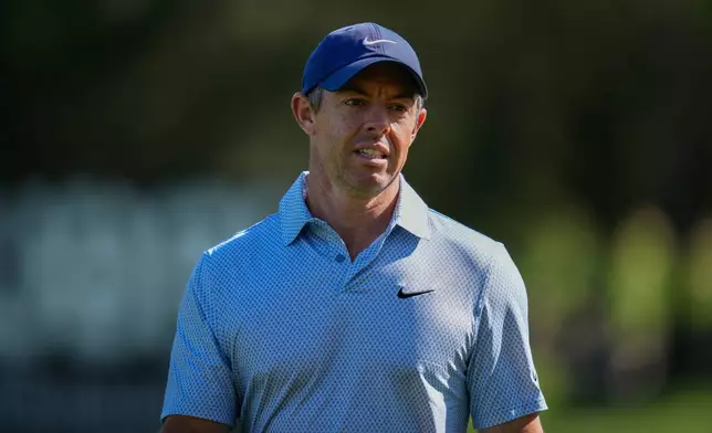 Rory McIlroy of Northern Ireland walks down the 16th fairway during the first round of the Dubai Desert Classic in United Arab Emirates, Thursday, Jan. 22, 2026. (AP Photo/Altaf Qadri)