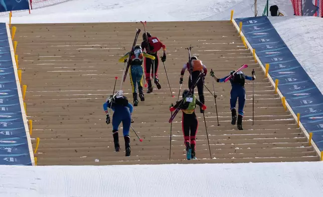 FILE - Athletes compete during the women's sprint race at the Ski Mountaineering World Cup event in Bormio, Italy, Saturday, Feb. 22, 2025. (AP Photo/Antonio Calanni, file)