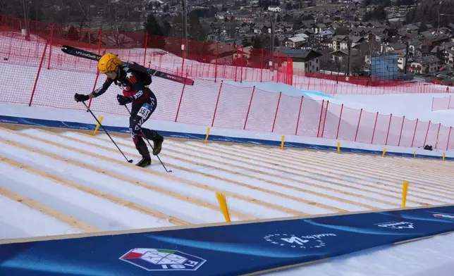 FILE - United States' Kelly Wolf competes during the women's mixed relay race at the Ski Mountaineering World Cup event in Bormio, Italy, Sunday, Feb. 23, 2025. (AP Photo/Antonio Calanni, File)