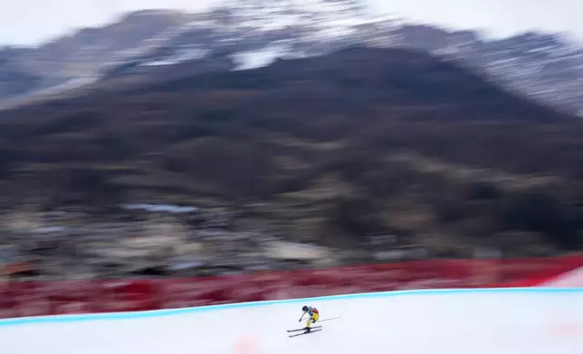 FILE - An athlete competes during the women's sprint race at the Ski Mountaineering World Cup event in Bormio, Italy, Saturday, Feb. 22, 2025. (AP Photo/Antonio Calanni, File)