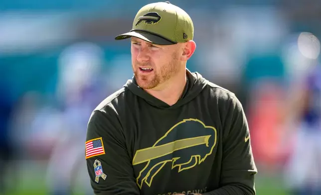 FILE - Buffalo Bills offensive coordinator Joe Brady stands on the field before an NFL football game against the Miami Dolphins, Nov. 9, 2025, in Miami Gardens, Fla. (AP Photo/Doug Murray, File)