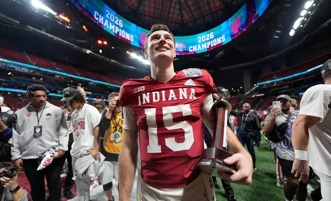 Indiana quarterback Fernando Mendoza (15) celebrates after the Peach Bowl NCAA college football playoff semifinal against Oregon, Friday, Jan. 9, 2026, in Atlanta. (AP Photo/Brynn Anderson)