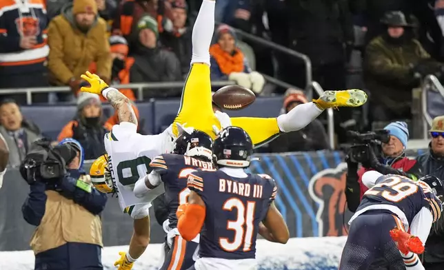Green Bay Packers' Christian Watson loses the ball as he tries to leap into the endzone after a catch during the first half of an NFL wild-card playoff football game against the Chicago Bears Saturday, Jan. 10, 2026, in Chicago. (AP Photo/Nam Huh)