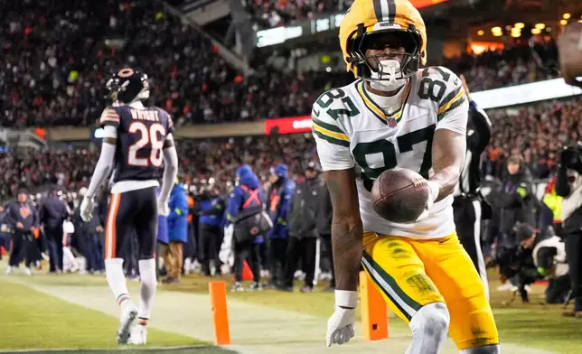 Green Bay Packers' Romeo Doubs celebrates his touchdown catch during the first half of an NFL wild-card playoff football game against the Chicago Bears Saturday, Jan. 10, 2026, in Chicago. (AP Photo/Nam Huh)