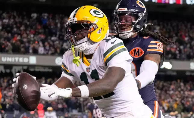 Green Bay Packers' Jayden Reed catches a touchdown pass during the first half of an NFL wild-card playoff football game against the Chicago Bears Saturday, Jan. 10, 2026, in Chicago. (AP Photo/Nam Huh)