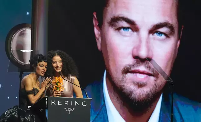 Teyana Taylor, left, and Chase Infiniti accept the desert palm achievement award on behlaf of Leonardo DiCaprio during the 37th Palm Springs International Film Festival Film Awards on Saturday, Jan. 3, 2026 at Palm Springs Convention Center in Palm Springs, Calif. (AP Photo/Chris Pizzello)