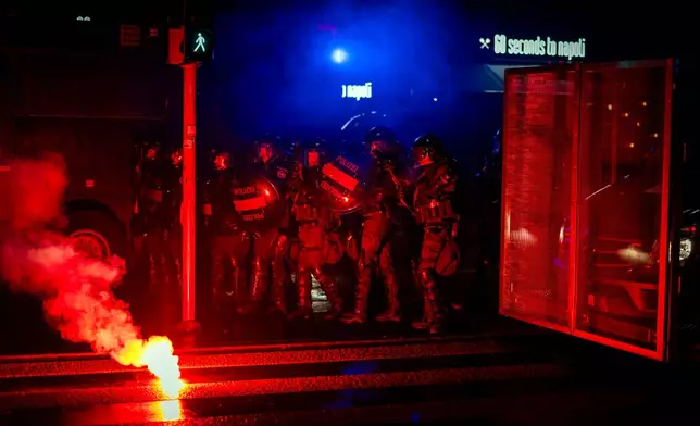 Riot police clash with protesters after a rally against the World Economic Forum and the visit of U.S. President Donald Trump to Switzerland, on Monday, Jan. 19, 2026 in Zurich, Switzerland. (Michael Buholzer/Keystone via AP)