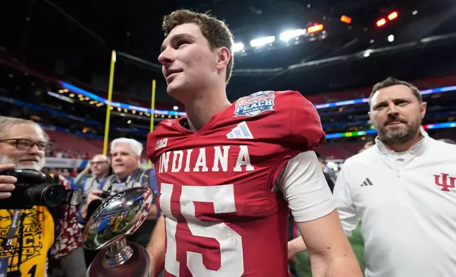 Indiana quarterback Fernando Mendoza (15) celebrates after the Peach Bowl NCAA college football playoff semifinal against Oregon, Friday, Jan. 9, 2026, in Atlanta. (AP Photo/Brynn Anderson)
