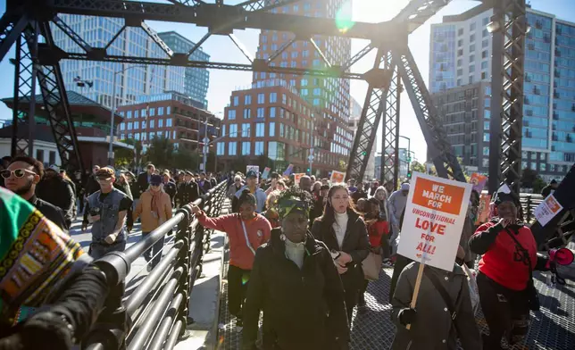 FILE - A crowd marches across the Lefty O'Doul Bridge during the MLK Day March in San Francisco on Monday, Jan. 20, 2025. (Dan Hernandez/San Francisco Chronicle via AP)/San Francisco Chronicle via AP, File)