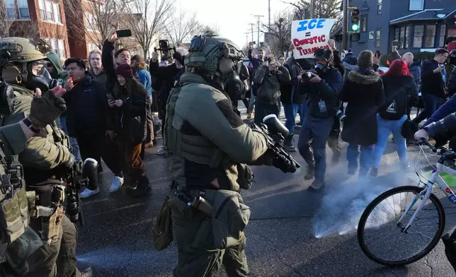 Tear gas is deployed amid protesters near the scene where Renee Good was fatally shot by an ICE officer last week, Tuesday, Jan. 13, 2026, in Minneapolis.(AP Photo/Adam Gray)