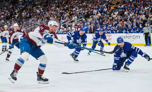 Colorado Avalanche's Brock Nelson (11) scores against the Toronto Maple Leafs during first period NHL hockey action in Toronto, on Sunday, Jan. 25, 2026. (Sammy Kogan/The Canadian Press via AP)