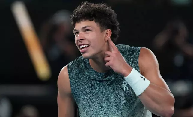 Ben Shelton of the U.S. celebrates after defeating Casper Ruud of Norway during their fourth round match at the Australian Open tennis championship in Melbourne, Australia, Monday, Jan. 26, 2026. (AP Photo/Aaron Favila)