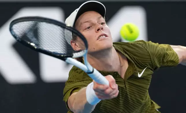 Jannik Sinner of Italy plays a forehand return to his compatriot Luciano Darderi during their fourth round match at the Australian Open tennis championship in Melbourne, Australia, Monday, Jan. 26, 2026. (AP Photo/Dar Yasin)