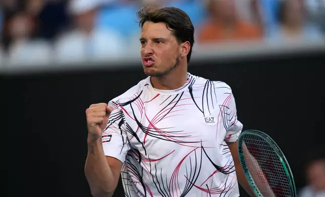 Luciano Darderi of Italy reacts as he plays against his compatriot Jannik Sinner during their fourth round match at the Australian Open tennis championship in Melbourne, Australia, Monday, Jan. 26, 2026. (AP Photo/Dar Yasin)