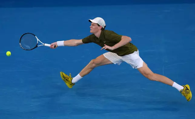 Jannik Sinner of Italy plays a forehand return to his compatriot Luciano Darderi during their fourth round match at the Australian Open tennis championship in Melbourne, Australia, Monday, Jan. 26, 2026. (AP Photo/Aaron Favila)