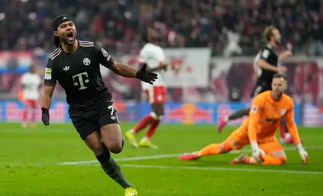 Bayern's Serge Gnabry celebrates after scoring his side's opening goal during the Bundesliga soccer match between RB Leipzig and FC Bayern Munich in Leipzig, Germany, Saturday, Jan. 17, 2026. (AP Photo/Matthias Schrader)
