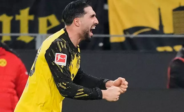Dortmund's Emre Can celebrates after he scored his side's decisive third goal from the penalty spot during the German Bundesliga soccer match between Borussia Dortmund and St. Pauli in Dortmund, Germany, Saturday, Jan. 17, 2026. (AP Photo/Martin Meissner)