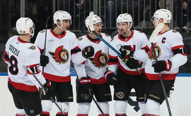 Ottawa Senators' Drake Batherson, second from right, celebrates with teammates after scoring a goal during the first period of an NHL hockey game against the New York Rangers Wednesday, Jan. 14, 2026, in New York. (AP Photo/Frank Franklin II)
