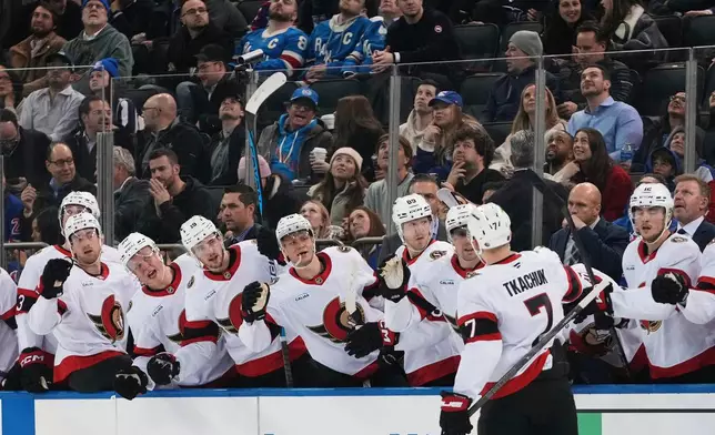 Ottawa Senators' Brady Tkachuk (7) celebrates with teammates after scoring a goal during the first period of an NHL hockey game against the New York Rangers Wednesday, Jan. 14, 2026, in New York. (AP Photo/Frank Franklin II)