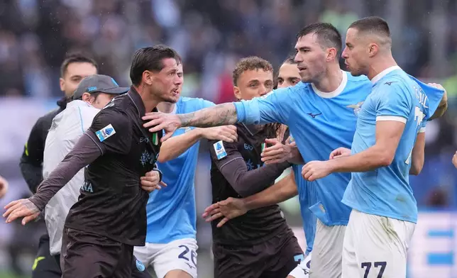 Napoli's Pasquale Mazzocchi, left, and Lazio's Adam Marusic during the Italian Serie A soccer match between SS Lazio and SSC Napoli in Rome, Sunday, Jan. 4, 2026. (Fabrizio Corradetti/LaPresse via AP)