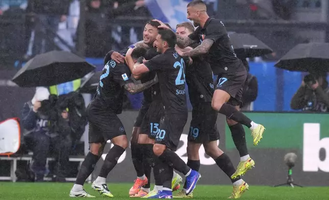 Napoli's Amir Rrahmani celebrates after scoring during the Italian Serie A soccer match between SS Lazio and SSC Napoli in Rome, Sunday, Jan. 4, 2026. (Fabrizio Corradetti/LaPresse via AP)