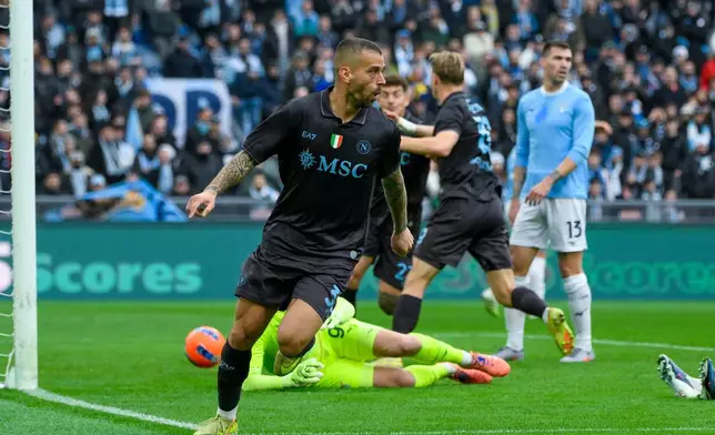 Napoli's Leonardo Spinazzola celebrates after scoring during the Italian Serie A soccer match between SS Lazio and SSC Napoli in Rome, Sunday, Jan. 4, 2026. (Fabrizio Corradetti/LaPresse via AP)