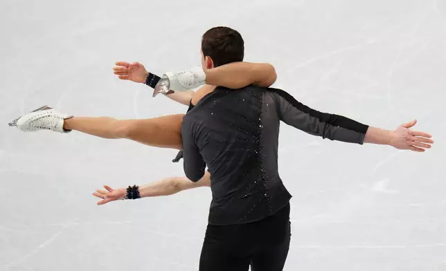 Alisa Efimova and Misha Mitrofanov, of the United States, compete in the Pairs Short Program at the ISU Four Continents Figure Skating Championships, in Beijing, China, Thursday, Jan. 22, 2026. (AP Photo/Andy Wong)