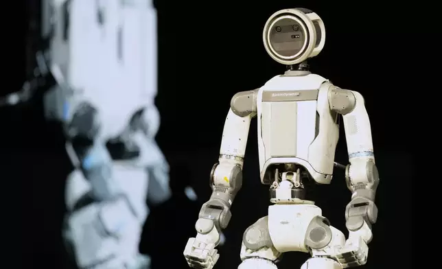 An Atlas robot stands on the stage during a Hyundai and Boston Dynamics news conference ahead of the CES tech show, Monday, Jan. 5, 2026, in Las Vegas. (AP Photo/Abbie Parr)