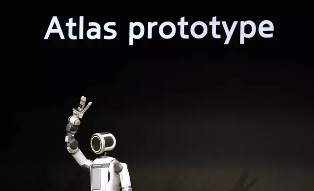 An Atlas robot stands on the stage during a Hyundai and Boston Dynamics news conference ahead of the CES tech show, Monday, Jan. 5, 2026, in Las Vegas. (AP Photo/Abbie Parr)