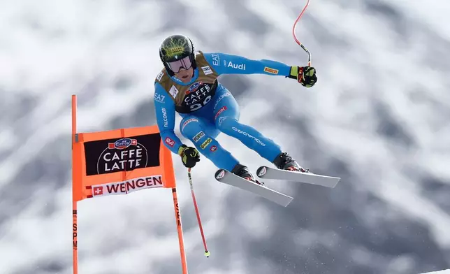 Italy's Giovanni Franzoni speeds down the course during an alpine ski, men's World Cup downhill, in Wengen, Switzerland, Saturday, Jan. 17, 2026. (AP Photo/Gabriele Facciotti)