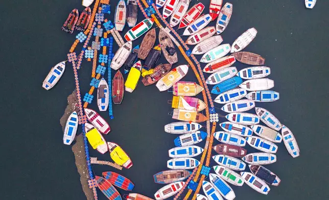 FILE - A large gathering of Hindu devotees is seen on Basant Panchami, the day which marks the advent of spring, at the confluence of rivers Ganges and Yamuna during the annual fair of Magh Mela in Prayagraj, India, Jan. 23, 2026. (AP Photo/Rajesh Kumar Singh, File)