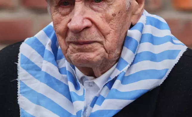 FILE - Holocaust survivor Stanislaw Zalewski walks in the Auschwitz Nazi death camp museum during a ceremony marking the 81th anniversary of the camp's liberation in Oswiecim, Poland, Tuesday, Jan. 27, 2026. (AP Photo/Beata Zawrzel, File)