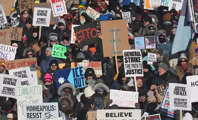 FILE - EDS NOTE: OBSCENITY - People protest against ICE (Immigration and Customs Enforcement) in downtown Minneapolis, Sunday, Jan. 25, 2026. (AP Photo/Adam Gray, File)