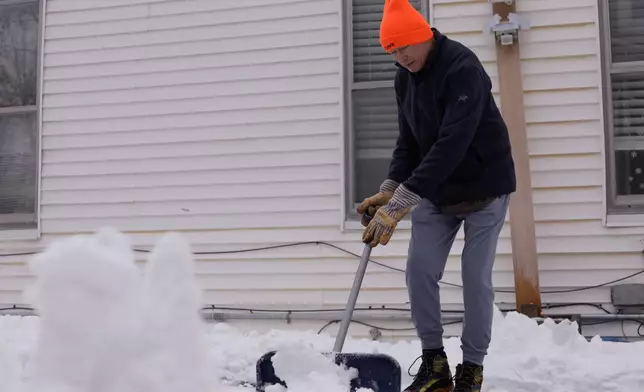 Richard Hill shovels his driveway on Wednesday, Jan. 7, 2026 in Vergennes, Vt. (AP Photo/Amanda Swinhart)