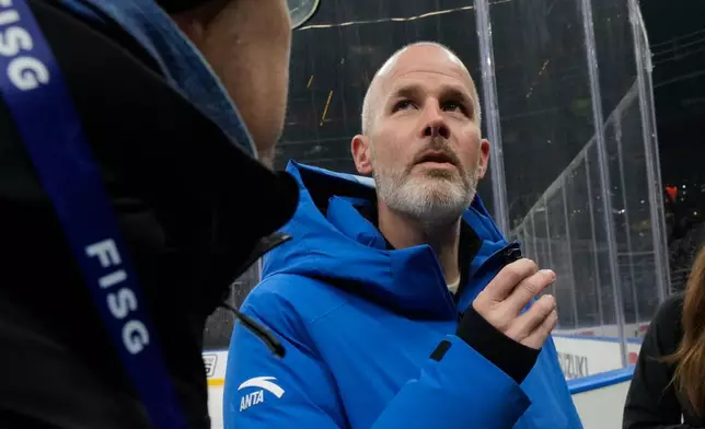 Pierre Ducrey, IOC Sport Director answers reporters at the Santa Giulia Ice Hockey Arena, where Ice Hockey discipline of the Milan Cortina 2026 Winter Olympics will take place, in Milan, Italy, Friday, Jan. 9, 2026. (AP Photo/Luca Bruno)