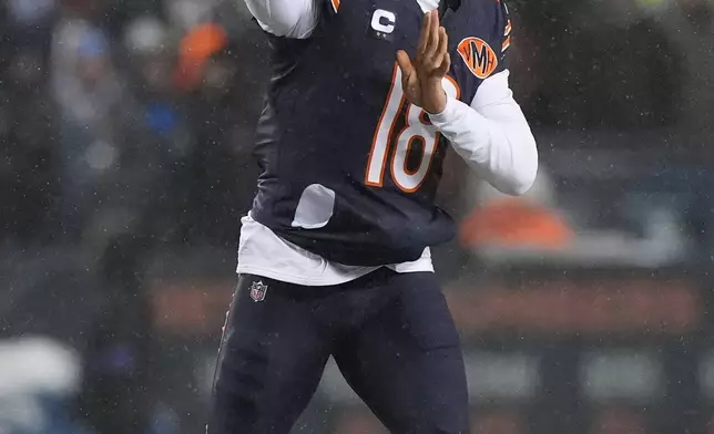 Chicago Bears quarterback Caleb Williams throws a pass against the Los Angeles Rams during the first half of an NFL football divisional playoff game Sunday, Jan. 18, 2026, in Chicago. (AP Photo/Nam Y. Huh)