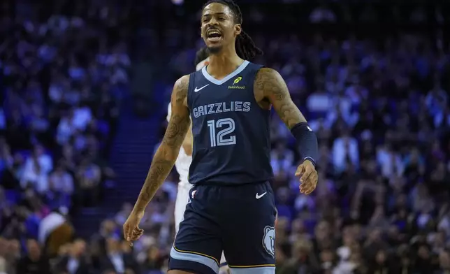 Memphis Grizzlies guard Ja Morant (12) reacts during the first half of NBA basketball game against the Orlando Magic Sunday, Jan. 18, 2026, in London. (AP Photo/Kin Cheung)