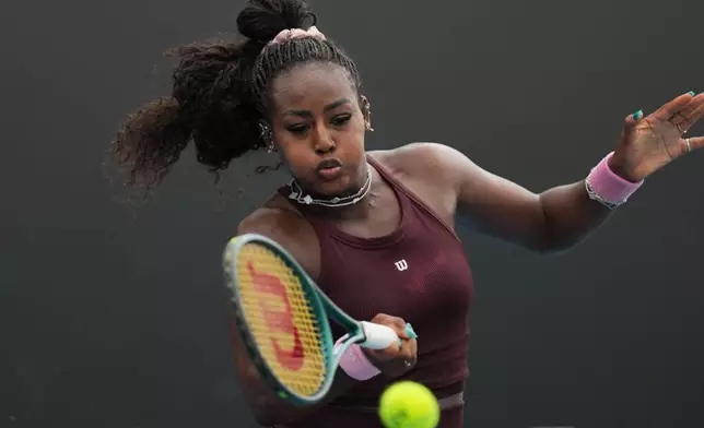 Alycia Parks of the U.S. plays a forehand return to Alexandra Eala of the Philippines during their first round match at the Australian Open tennis championship in Melbourne, Australia, Monday, Jan. 19, 2026. (AP Photo/Dar Yasin)
